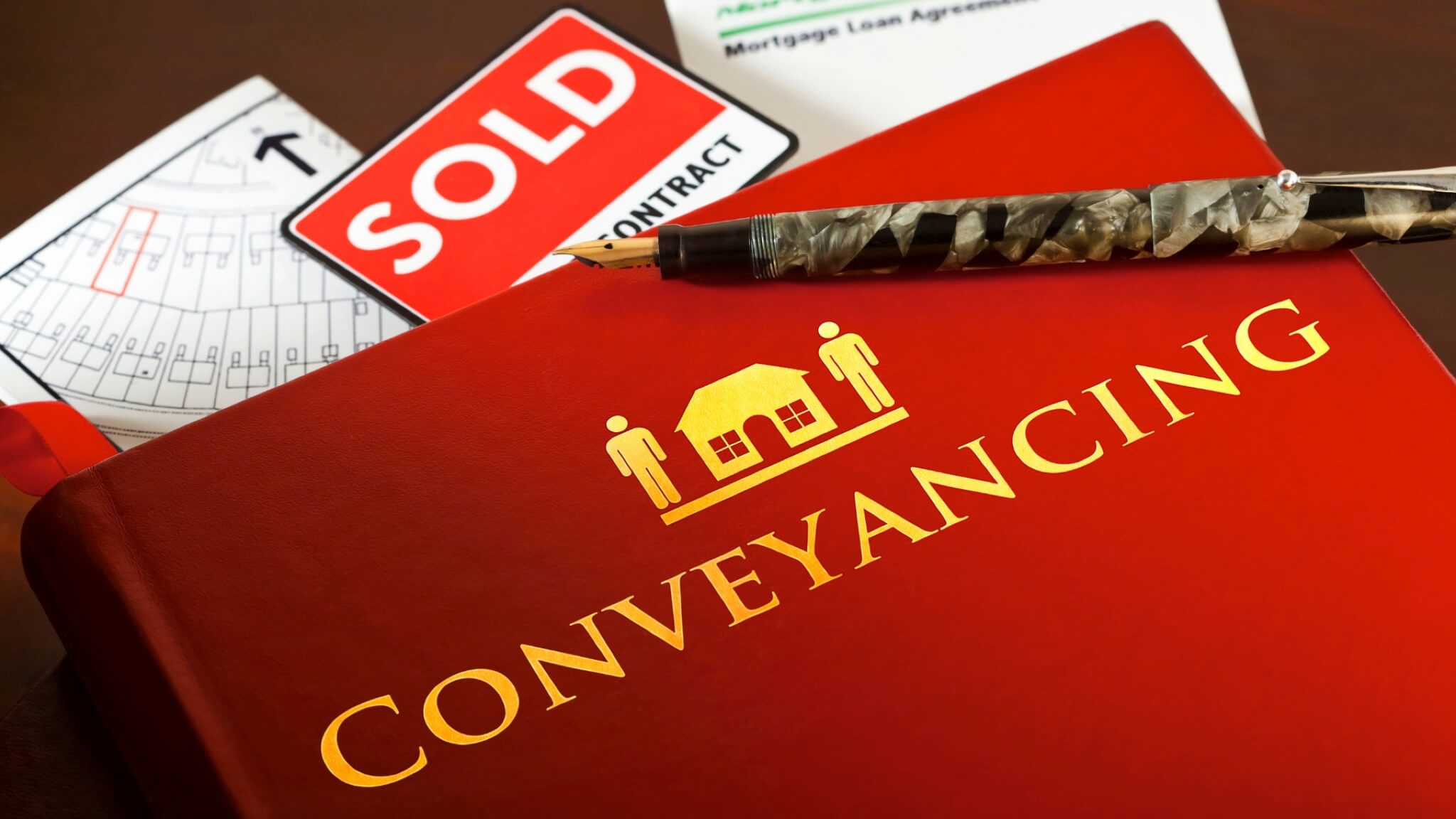 Conveyancing document with pen and sold sign