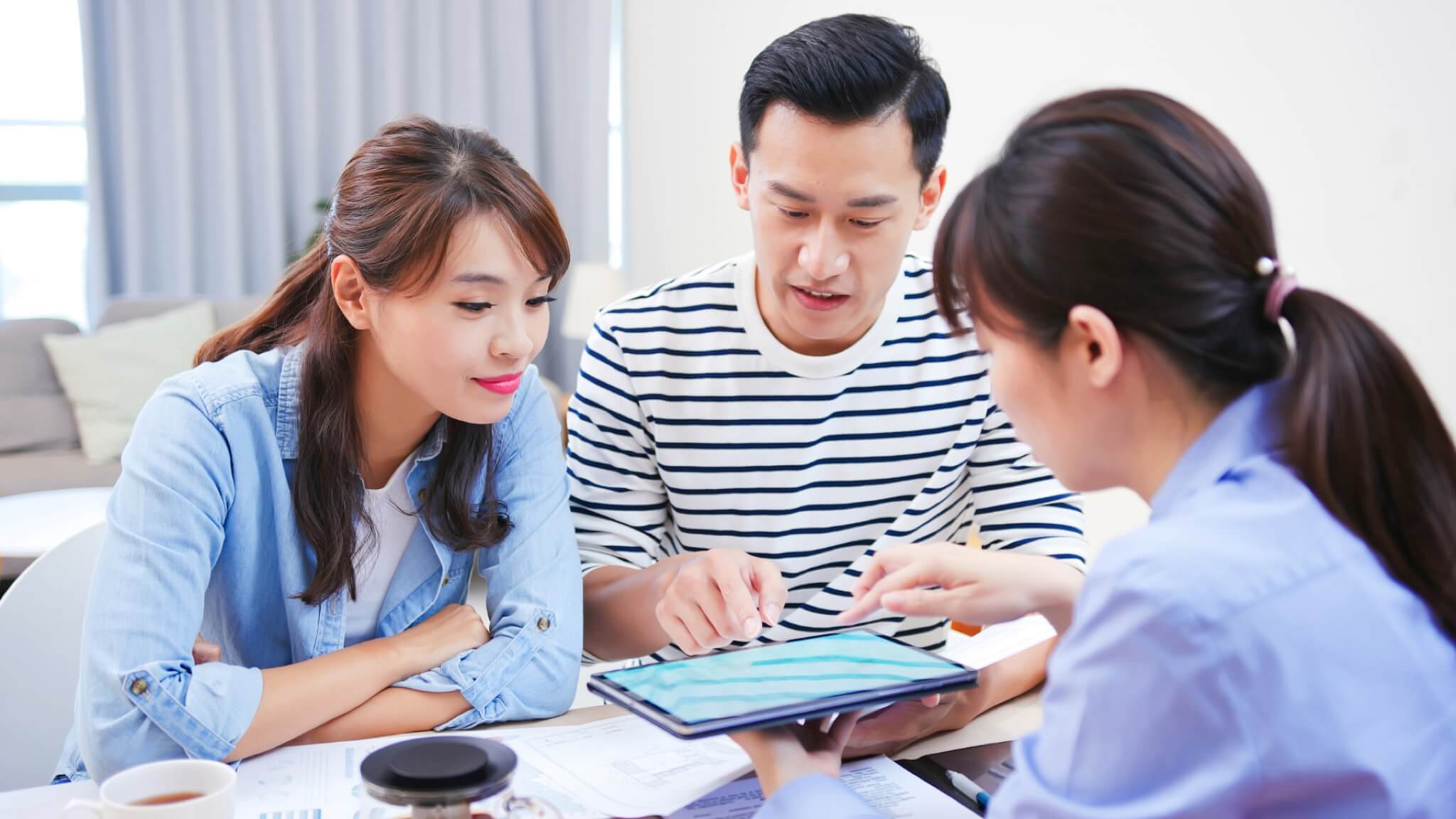 Couple with iPad letting property